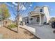 Backyard patio with a covered seating area and a grill, perfect for outdoor entertaining at 7961 E 131St Ave, Thornton, CO 80602