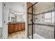 This bathroom features a tiled shower and vanity with double sinks at 7961 E 131St Ave, Thornton, CO 80602