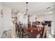Spacious dining area showcasing modern lighting and easy access to living and kitchen spaces at 7961 E 131St Ave, Thornton, CO 80602