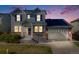 Charming two-story home features a well-manicured lawn, inviting porch, and attached garage at 7961 E 131St Ave, Thornton, CO 80602