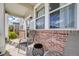 Relaxing front porch view with comfortable seating, perfect for enjoying quiet moments outdoors at 7961 E 131St Ave, Thornton, CO 80602