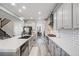Contemporary kitchen with stainless steel appliances, a central island, and an open layout at 7961 E 131St Ave, Thornton, CO 80602