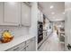 Modern kitchen featuring sleek cabinets, stainless steel appliances, and stylish subway tile backsplash at 7961 E 131St Ave, Thornton, CO 80602