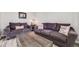 Comfortable living room with plush sofas, decorative pillows, and a cozy coffee table at 7961 E 131St Ave, Thornton, CO 80602