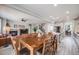 Open concept living room and kitchen area with wood floors, a fireplace, and staircase at 7961 E 131St Ave, Thornton, CO 80602