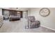 This main bedroom features a cozy sitting area, carpeting and neutral walls and trim at 7961 E 131St Ave, Thornton, CO 80602