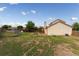 Backyard featuring a chain-link fence and a view of the home's exterior at 9563 Milwaukee Ct, Thornton, CO 80229