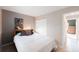 Bedroom showcasing a bed and large window with natural light and a closet at 9563 Milwaukee Ct, Thornton, CO 80229
