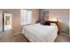 Bedroom showcasing a bed and large window with natural light and a walk in closet at 9563 Milwaukee Ct, Thornton, CO 80229