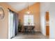 Cozy dining area with a stylish chandelier and access to the outdoors at 9563 Milwaukee Ct, Thornton, CO 80229