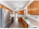 Functional kitchen equipped with modern appliances, ample cabinet space, and a stainless steel refrigerator at 9563 Milwaukee Ct, Thornton, CO 80229