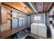 Unfinished laundry room with side by side washer and dryer at 9563 Milwaukee Ct, Thornton, CO 80229