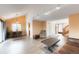 Open-concept living space with vaulted ceilings, modern lighting, and wood-look flooring at 9563 Milwaukee Ct, Thornton, CO 80229