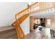 Open floor plan with a wood staircase leading down to a living room with a fireplace at 9563 Milwaukee Ct, Thornton, CO 80229