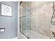 Updated bathroom with a large walk-in shower and tiled walls at 3346 S Quintero St, Aurora, CO 80013