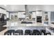 Granite kitchen island with stainless steel appliances and white shaker cabinets at 3346 S Quintero St, Aurora, CO 80013