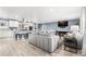 Open concept kitchen with white cabinets, granite countertops, and stainless steel appliances at 3346 S Quintero St, Aurora, CO 80013