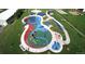 Aerial shot of a community playground featuring colorful play structures and green spaces at 9980 W Jewell Ave # B, Lakewood, CO 80232