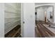 Walk-in pantry featuring plentiful metal shelving and light-toned floors at 9980 W Jewell Ave # B, Lakewood, CO 80232