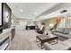 Entertainment basement boasts a home theater, fireplace, wet bar and comfortable seating at 10104 Nadine Ave, Parker, CO 80134
