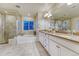 Bright bathroom with dual vanity, soaking tub, and tiled shower at 10104 Nadine Ave, Parker, CO 80134