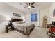 Cozy bedroom with a comfy bed, neutral color palette, and large window for natural light at 10104 Nadine Ave, Parker, CO 80134