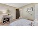 Bright bedroom featuring a desk, carpet floors, and decor at 10104 Nadine Ave, Parker, CO 80134