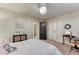 Bright bedroom featuring desk, carpet floors, and modern light fixture at 10104 Nadine Ave, Parker, CO 80134