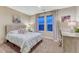 Comfortable bedroom with desk, windows, and carpet floors at 10104 Nadine Ave, Parker, CO 80134