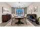 Formal dining room with a dark wood table, chandelier, and elegant decor at 10104 Nadine Ave, Parker, CO 80134
