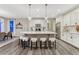 Bright kitchen with a large island, stainless steel appliances and modern finishes at 10104 Nadine Ave, Parker, CO 80134