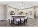 Modern kitchen with quartz countertops, stainless appliances and an island with bar seating at 10104 Nadine Ave, Parker, CO 80134