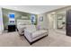 Relaxing bedroom with carpet floors and a decorative mirror at 10104 Nadine Ave, Parker, CO 80134