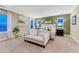 Cozy bedroom featuring a sitting area, carpet floors, and decor at 10104 Nadine Ave, Parker, CO 80134