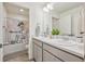 Shared bathroom with double sinks and a fun shower curtain at 803 William Way, Brighton, CO 80603