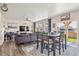 Bright dining area with view to backyard and sliding glass doors at 803 William Way, Brighton, CO 80603