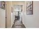 Hallway with view of living room and stylish rug at 803 William Way, Brighton, CO 80603