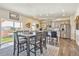Bright kitchen features a dining area and access to the backyard at 803 William Way, Brighton, CO 80603