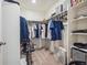 Large walk-in closet with ample shelving and hanging space at 803 William Way, Brighton, CO 80603