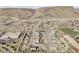 Enjoy this stunning aerial view of a community nestled near the mountains and a soccer field at 16791 W 48Th Ln, Golden, CO 80403