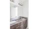 Bathroom featuring double sinks, grey countertop, and modern finishes at 16791 W 48Th Ln, Golden, CO 80403
