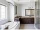 Modern bathroom featuring a soaking tub, vanity, and mosaic tile at 16791 W 48Th Ln, Golden, CO 80403