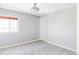 This bedroom features neutral paint, carpet, and a window with blinds at 16791 W 48Th Ln, Golden, CO 80403