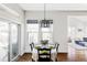 Bright dining area with a table set for a meal, a decorative chandelier, and natural light at 16791 W 48Th Ln, Golden, CO 80403
