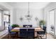 Formal dining room with wood table, chandelier, and modern decor at 16791 W 48Th Ln, Golden, CO 80403