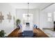 Dining room with wood table, slider to outdoor patio and chandelier at 16791 W 48Th Ln, Golden, CO 80403