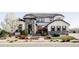 Stunning stucco and stone two-story home with a landscaped front yard and a welcoming entryway at 16791 W 48Th Ln, Golden, CO 80403