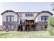 This home features stone accents, a deck and a backyard area at 16791 W 48Th Ln, Golden, CO 80403