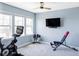 Bright exercise room featuring a ceiling fan and a variety of fitness equipment at 16791 W 48Th Ln, Golden, CO 80403