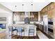 Spacious kitchen featuring a large island, stainless steel appliances, and stylish pendant lighting at 16791 W 48Th Ln, Golden, CO 80403
